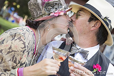 Mixed-Race Couple Dressed in 1920â€™s Era Fashion Sipping Champagne Stock Photo